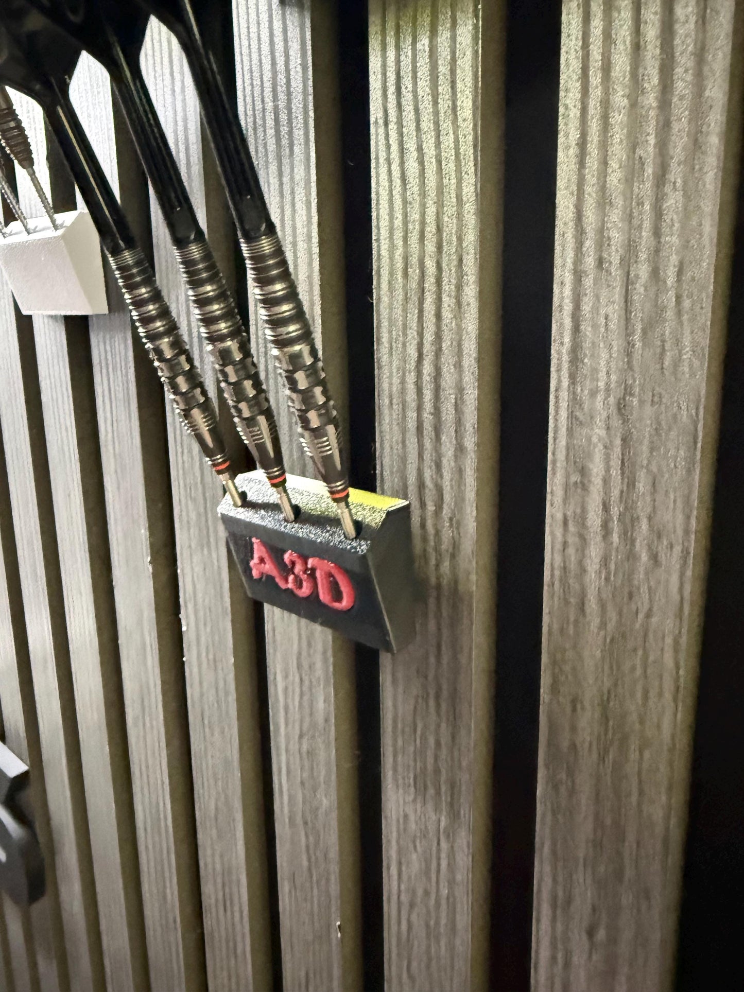 Personalised dart hold that is designed for Acoustic wood panels.