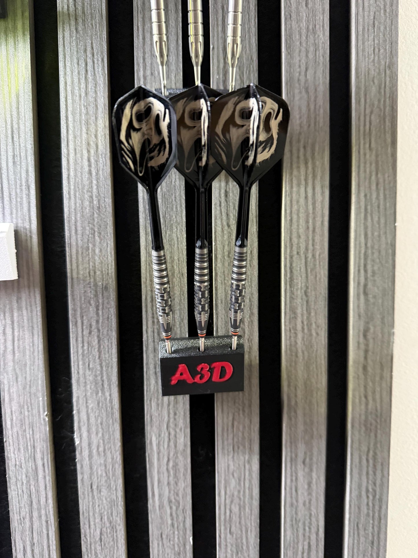 Personalised dart hold that is designed for Acoustic wood panels.